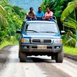 **

"A family-friendly scene showcasing a sturdy 4x4 vehicle driving on a rural road in Vanuatu, surrounded by lush tropical vegetation. The road is partially unpaved with some potholes. In the background, local children are waving from a safe distance.  The vehicle is fully clothed with tourists. safe for work, appropriate content, professional, modest, perfect anatomy, correct proportions, natural pose, well-formed hands, proper finger count, natural body proportions, daylight, clear sky, vibrant colors."

**